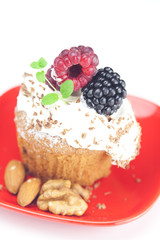 muffin with whipped cream,mint, raspberries, blackberries and nu