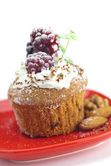 muffin with whipped cream,mint, raspberries, blackberries and nu