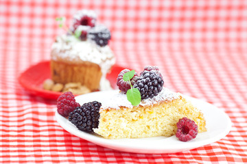 muffin with whipped cream, cake with icing, raspberry, blackberr