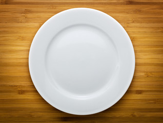 Plate on wood background