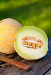 ripe melon on wooden table