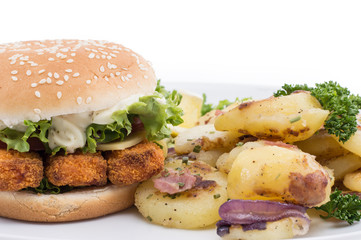 Plate with fried Potatoes and a Fish Burger