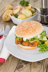 Fish Burger with fried Potatoes in a bowl