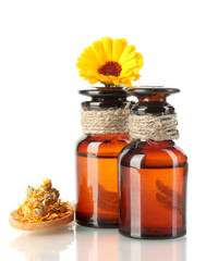 medicine bottles and calendula, isolated on white