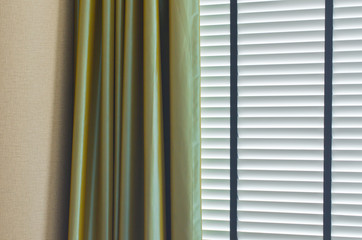 white closed jalousie at day illumination