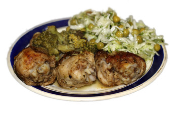 Fried chiken and cabbage broccoli on the plate