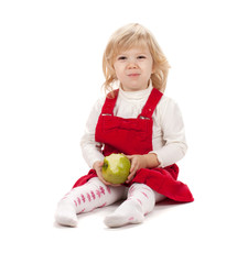 Fototapeta premium Baby girl eating apple