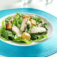 grilled chicken on caesar salad