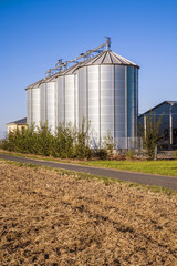 field in harvest with silo © travelview