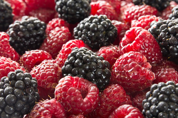 Stack of raspberry and blackberry as background