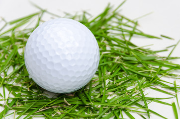 white golf ball on fresh grass