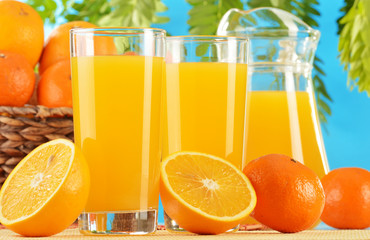 Composition with two glasses of orange juice and fruits