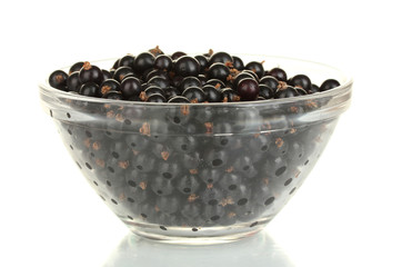Fresh black currant in transparent bowl isolated on white
