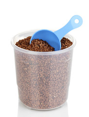 Measuring spoon and plastic container with grain isolated