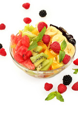 fresh fruits salad in bowl  and berries, isolated on white