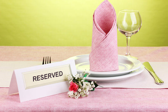 Table Setting With Reserved Card In Restaurant