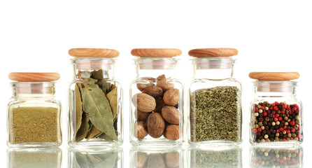 powder spices in glass jars  isolated on white