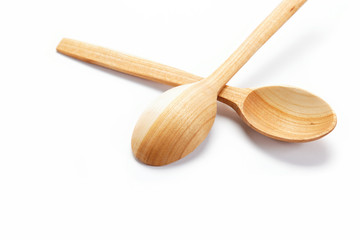 Wooden spoon isolated on a white background.