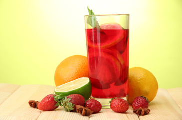 Refreshing sangria in glass with fruits,