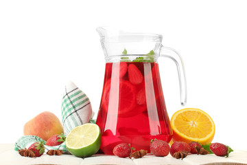 sangria in jar with fruits, on white wooden table