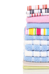 Colorful kitchen towels on white background close-up