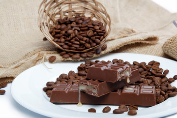 Chocolate and coffee beans on sacking.