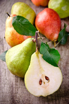 harvested pears on old wooden background