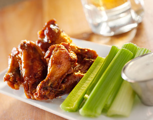 bbq buffalo wings with celery and ranch.