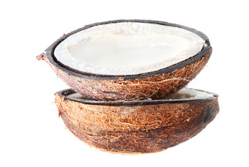 two halfs of coconut with milk isolated on white background