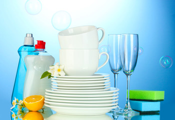 empty clean plates, glasses and cups with dishwashing liquid,