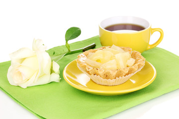 sweet cake with cup of tea isolated on white