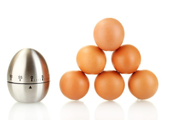 egg timer and eggs isolated on white