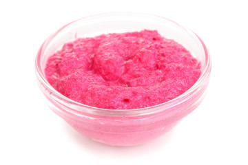Horseradish red sauce in glass bowl isolated on white