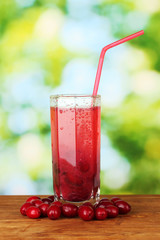 Compote from a cornel on green background close-up