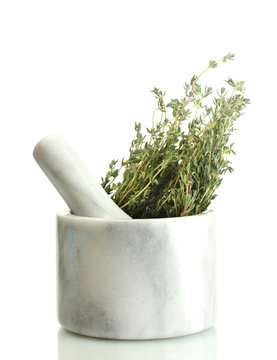 mortar with fresh green thyme isolated on white