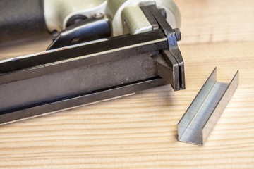 Staple gun on wood table