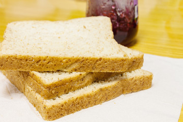 Slice of whole wheet bread with jam