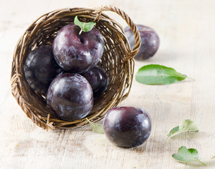 Group of plums in basket