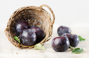 Group of plums in basket