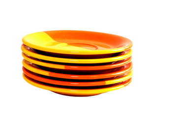 Pile of colourful plates isolated on white background
