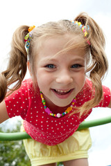 Playful girl plays on the playground