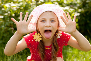 Funny little girl with pigtails
