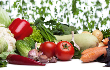 Fresh vegetables on white.