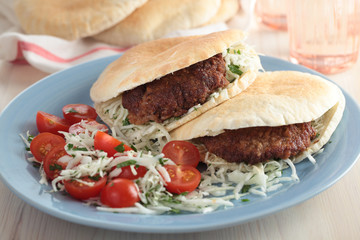 Pita with burgers and salad