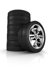 stack of car wheels on white background