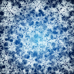 Christmas background made ​​of realistic falling snowflakes.
