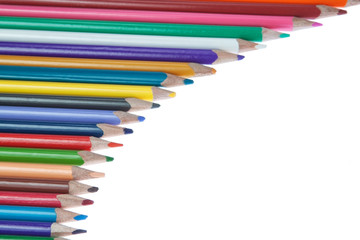 Coloured pencils in a frame. On a white background.