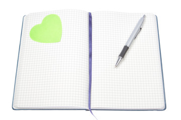 Open notepad with a pen and a green heart.