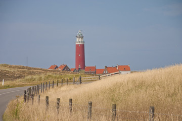 Red lighthouse, little houses on Texel island