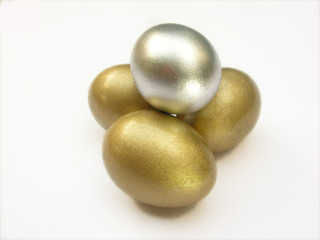 golden and silver color egg